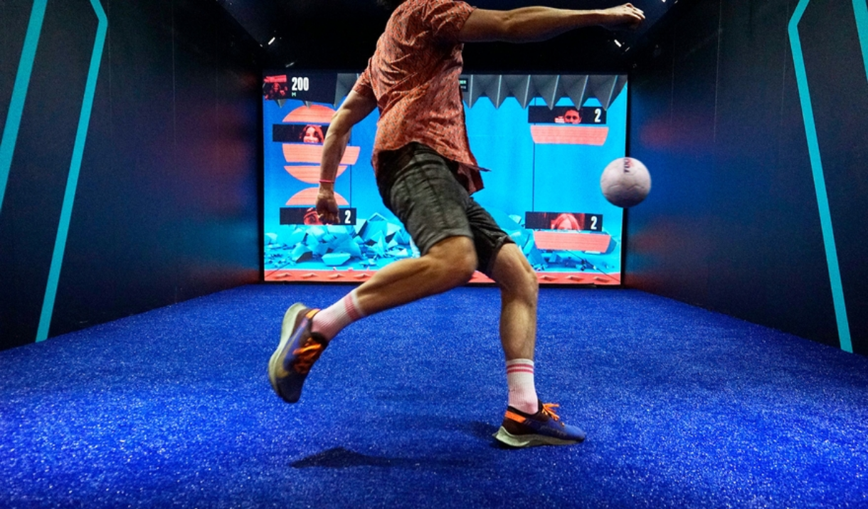 A man kicks a ball at TOCA Social